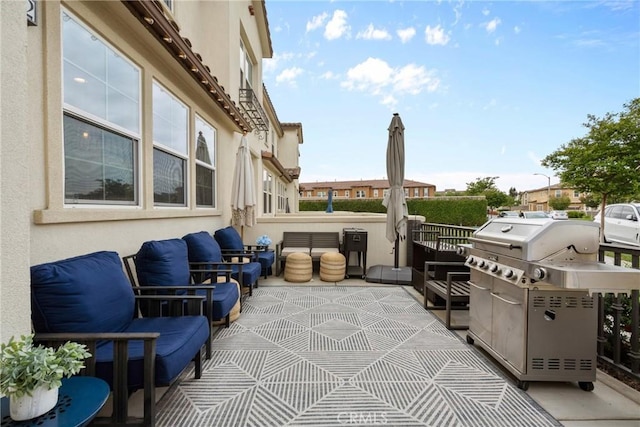 view of patio with area for grilling and outdoor lounge area