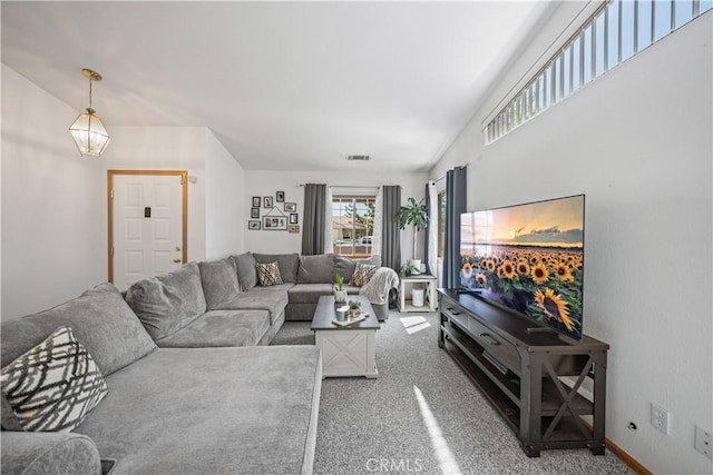living area with carpet floors and visible vents