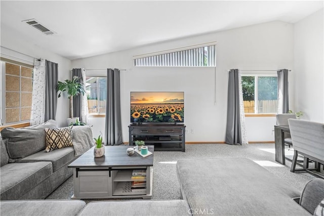 living room featuring carpet flooring, baseboards, visible vents, and vaulted ceiling