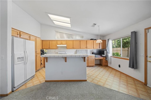 kitchen with visible vents, lofted ceiling, light floors, tile counters, and white fridge with ice dispenser