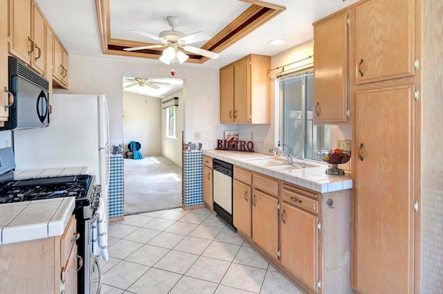 28320 Via Bandita, Menifee, CA 92585 - kitchen with black microwave, dishwashing machine, tile countertops, and stainless steel gas stove