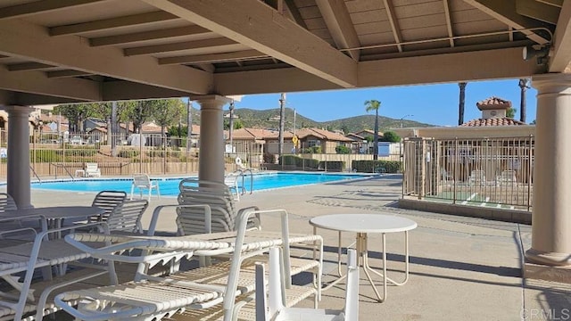28320 Via Bandita, Menifee, CA 92585 - pool featuring fence, a patio area, a residential view, and a mountain view