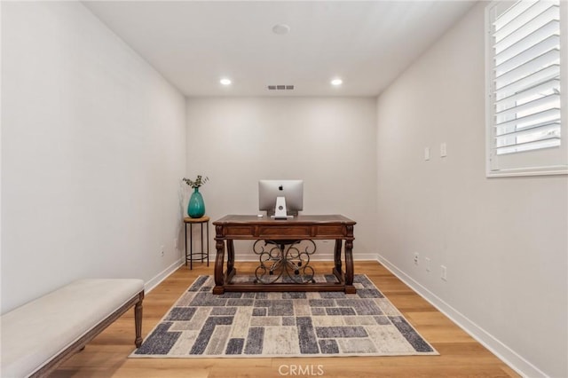 office featuring baseboards, light wood-style flooring, visible vents, and recessed lighting