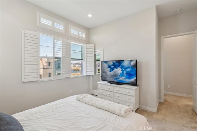 bedroom featuring recessed lighting, carpet floors, and baseboards