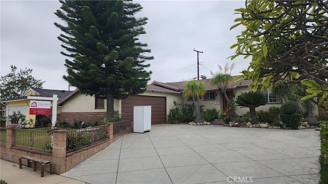 1711 S Washington Ave, Glendora, CA 91740 - view of front of home featuring driveway, stucco siding, brick siding, and a garage