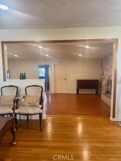 1711 S Washington Ave, Glendora, CA 91740 - living area featuring wood finished floors and a textured ceiling