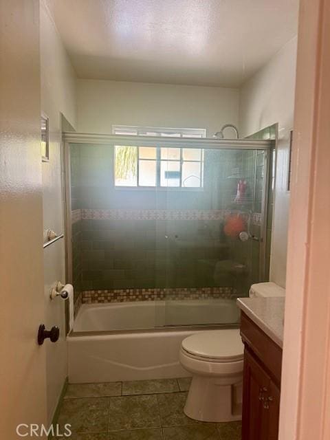 1711 S Washington Ave, Glendora, CA 91740 - full bathroom with tile patterned flooring, vanity, toilet, and combined bath / shower with glass door