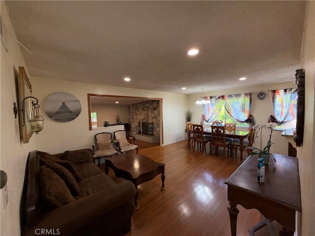 1711 S Washington Ave, Glendora, CA 91740 - living room with wood finished floors, recessed lighting, a fireplace, and a textured ceiling