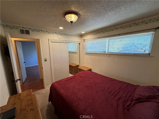 1711 S Washington Ave, Glendora, CA 91740 - carpeted bedroom with a textured ceiling and recessed lighting