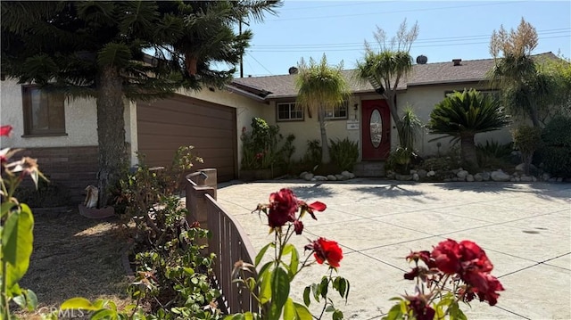 1711 S Washington Ave, Glendora, CA 91740 - ranch-style home featuring a garage, driveway, and stucco siding