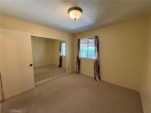 1711 S Washington Ave, Glendora, CA 91740 - unfurnished bedroom with carpet, a textured ceiling, and a closet