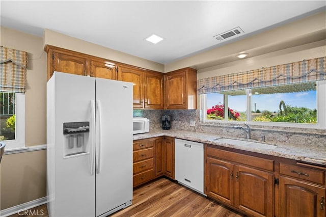415 S Cedarhaven Way, Anaheim Hills, CA 92807 - kitchen with white appliances, brown cabinets, visible vents, and a sink