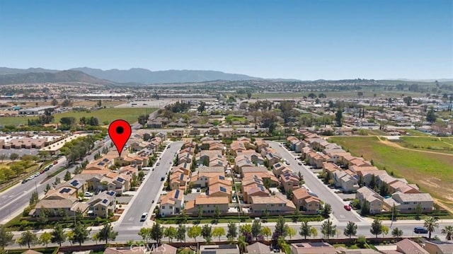 drone / aerial view featuring a mountain view and a residential view