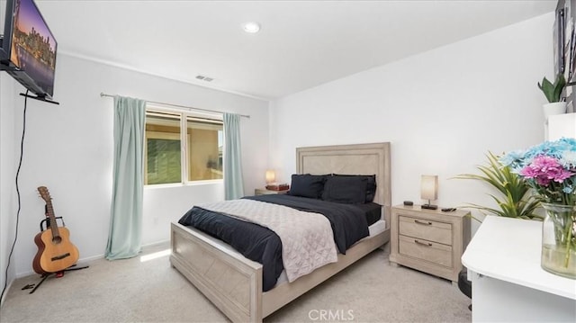 bedroom featuring recessed lighting, baseboards, light colored carpet, and visible vents