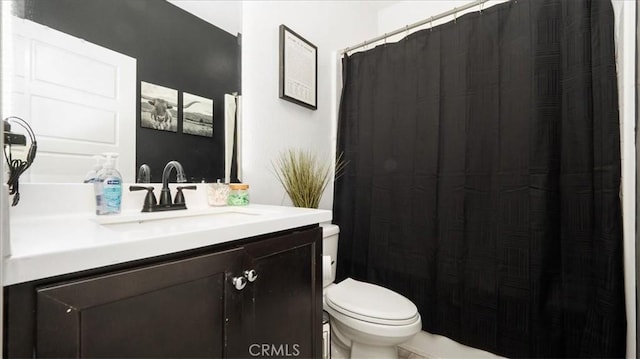 bathroom with vanity, toilet, and a shower with curtain