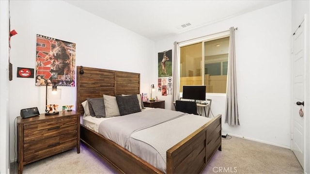 bedroom with light colored carpet and visible vents
