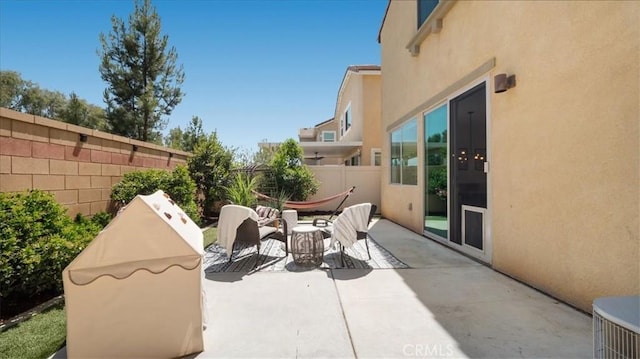 view of patio / terrace featuring area for grilling and fence