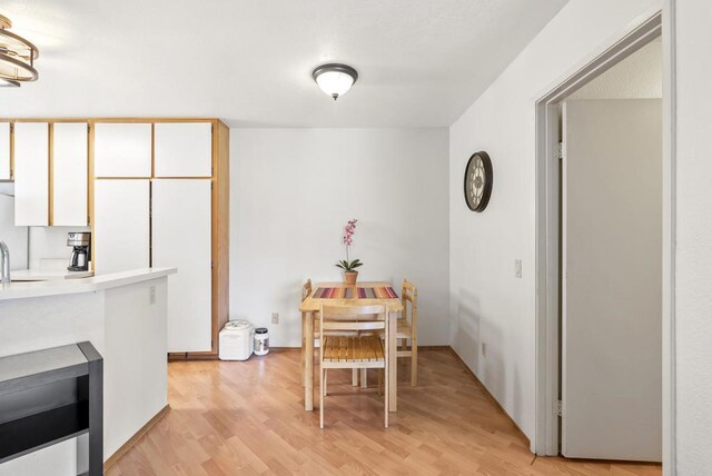 9725 Mesa Springs Way Unit 176, San Diego, CA 92126 - dining area with light wood-type flooring