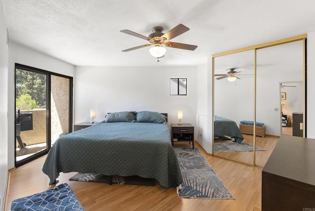 9725 Mesa Springs Way Unit 176, San Diego, CA 92126 - bedroom with access to exterior, wood finished floors, ceiling fan, and a closet