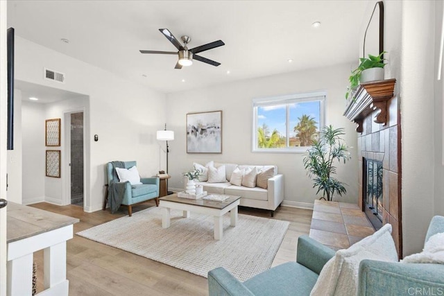 720 San Luis Obispo Pl Unit D, San Diego, CA 92109 - living room featuring a ceiling fan, a tile fireplace, light wood-style flooring, visible vents, and recessed lighting