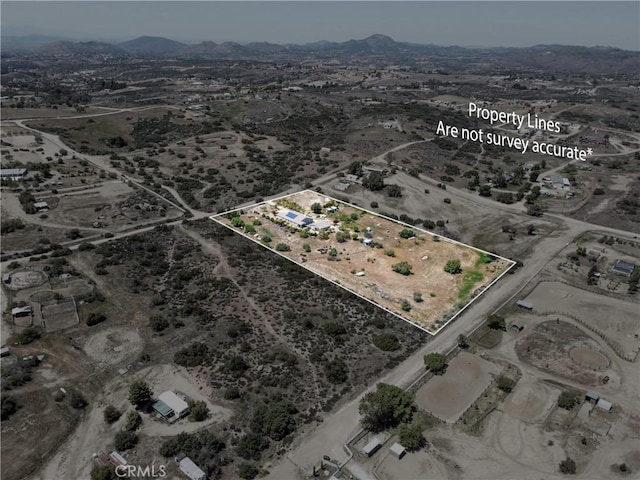 bird's eye view with a rural view, a mountain view, and a desert view