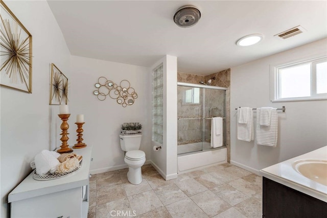 6901 Bertrand Ave, Reseda, CA 91335 - bathroom featuring vanity, toilet, visible vents, enclosed tub / shower combo, and baseboards