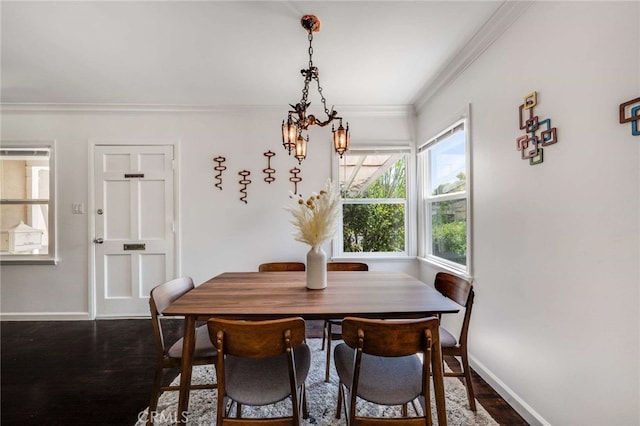 6901 Bertrand Ave, Reseda, CA 91335 - dining space featuring a chandelier, crown molding, and dark wood-style flooring