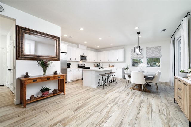 4160 S Bodega Way Unit 2, Ontario, CA 91761 - dining room with recessed lighting, light wood-style flooring, and baseboards