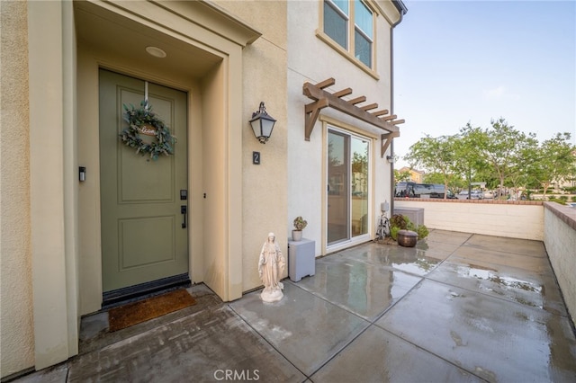 4160 S Bodega Way Unit 2, Ontario, CA 91761 - doorway to property with stucco siding and a patio area