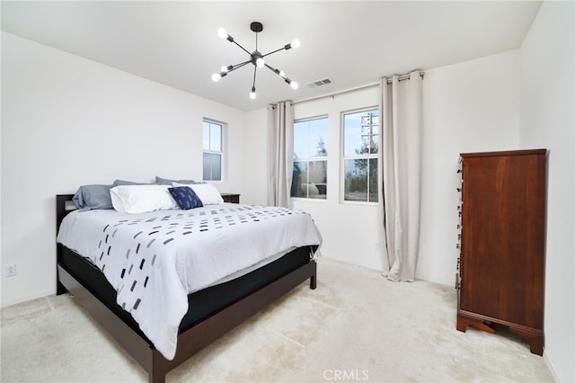 bedroom featuring light carpet, a chandelier, and multiple windows