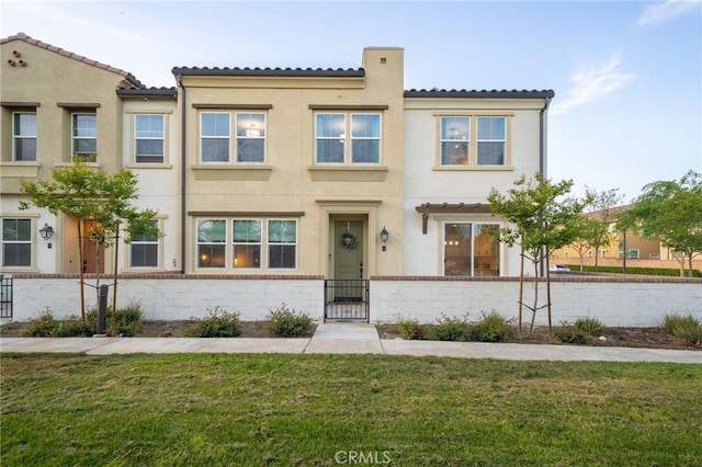 4160 S Bodega Way Unit 2, Ontario, CA 91761 - townhome / multi-family property with stucco siding, a tile roof, and a gate