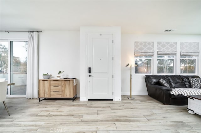 4160 S Bodega Way Unit 2, Ontario, CA 91761 - entrance foyer with light wood finished floors and baseboards