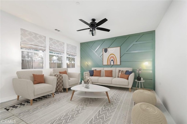 4160 S Bodega Way Unit 2, Ontario, CA 91761 - living room featuring ceiling fan, wood finished floors, a decorative wall, baseboards, and an accent wall