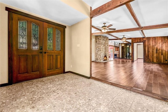 2310 Las Palomas Dr, La Habra Heights, CA 90631 - foyer entrance featuring beamed ceiling, a ceiling fan, baseboards, and wood walls