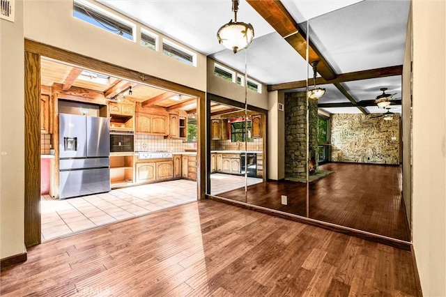 2310 Las Palomas Dr, La Habra Heights, CA 90631 - interior space with ceiling fan, visible vents, beamed ceiling, and light wood-style flooring