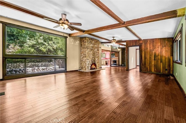 2310 Las Palomas Dr, La Habra Heights, CA 90631 - unfurnished living room with beamed ceiling, a ceiling fan, wood finished floors, and a fireplace