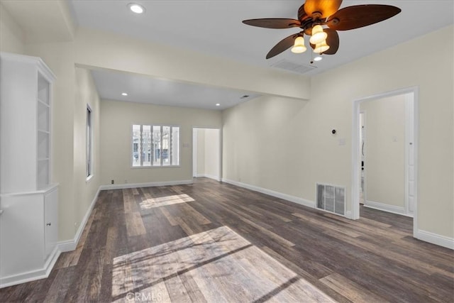 unfurnished living room with baseboards, a ceiling fan, wood finished floors, and visible vents