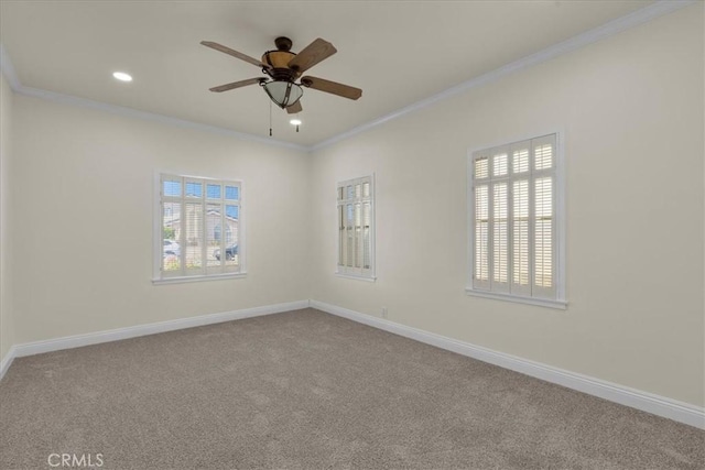 carpeted empty room featuring recessed lighting, crown molding, baseboards, and ceiling fan