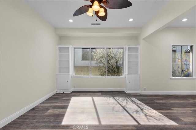 spare room featuring visible vents, baseboards, recessed lighting, a ceiling fan, and wood finished floors