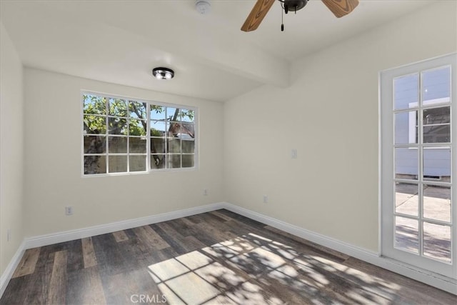 spare room with ceiling fan, baseboards, and wood finished floors