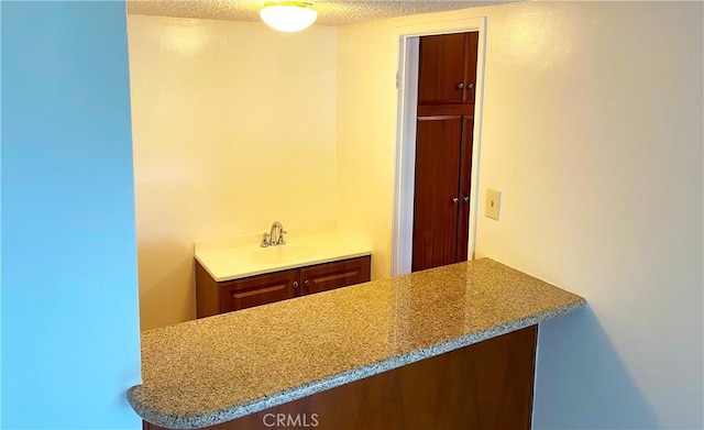 400 S Los Robles Ave Unit 306, Pasadena, CA 91101 - bathroom with a textured ceiling and vanity