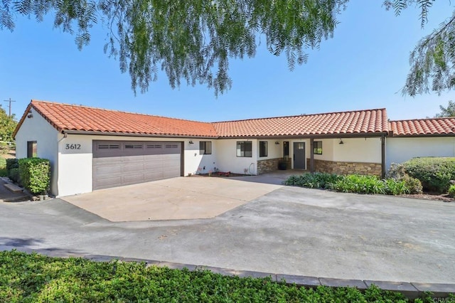 3612 Palomar Dr, Fallbrook, CA 92028 - view of front of property featuring a garage, stucco siding, concrete driveway, stone siding, and a tile roof