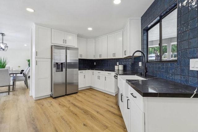 3612 Palomar Dr, Fallbrook, CA 92028 - kitchen featuring stainless steel fridge with ice dispenser, white cabinetry, backsplash, light wood-style floors, and recessed lighting
