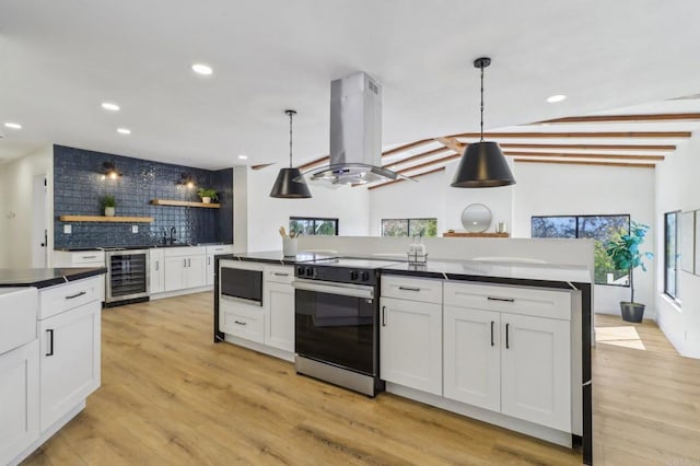 3612 Palomar Dr, Fallbrook, CA 92028 - kitchen featuring range with electric stovetop, island range hood, beverage cooler, dark countertops, and recessed lighting