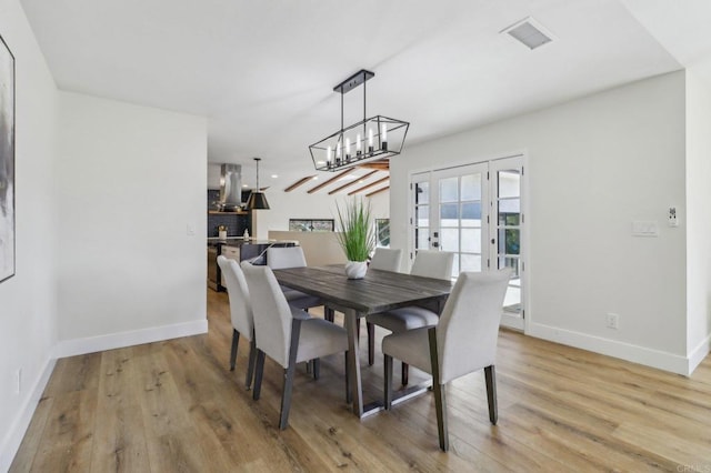 3612 Palomar Dr, Fallbrook, CA 92028 - dining area with light wood-type flooring, a chandelier, and french doors