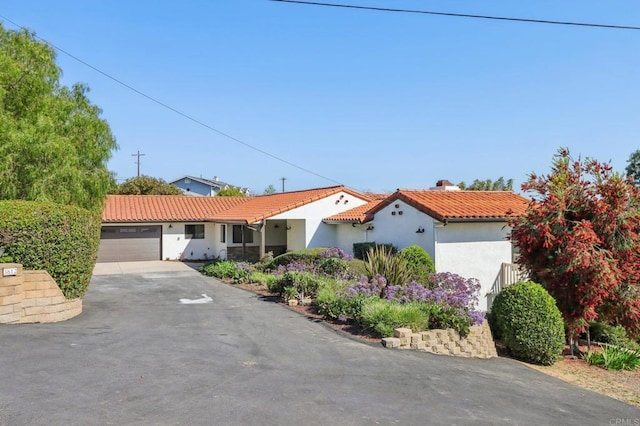 3612 Palomar Dr, Fallbrook, CA 92028 - view of front of property with a tiled roof, stucco siding, a chimney, a garage, and driveway