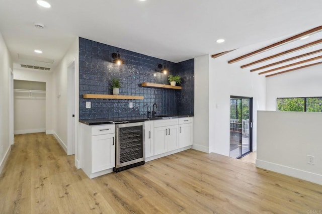 3612 Palomar Dr, Fallbrook, CA 92028 - indoor wet bar with decorative backsplash, beverage cooler, light wood-style flooring, recessed lighting, and beamed ceiling