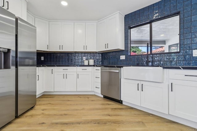 3612 Palomar Dr, Fallbrook, CA 92028 - kitchen featuring appliances with stainless steel finishes, dark countertops, white cabinets, backsplash, and recessed lighting