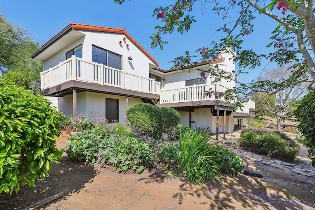 3612 Palomar Dr, Fallbrook, CA 92028 - back of property with stucco siding, a balcony, and a tiled roof