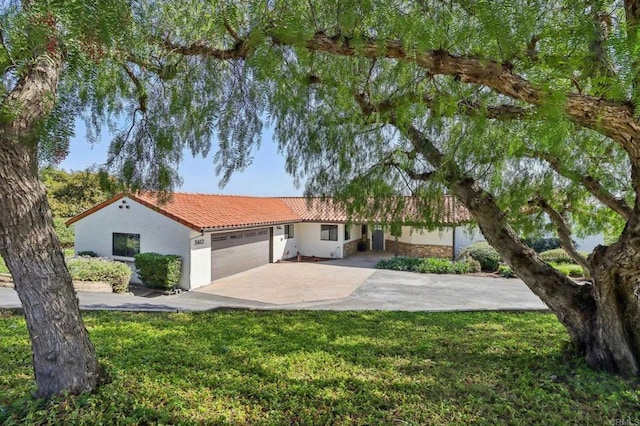3612 Palomar Dr, Fallbrook, CA 92028 - view of front of property featuring a garage, a tile roof, driveway, stucco siding, and a front lawn